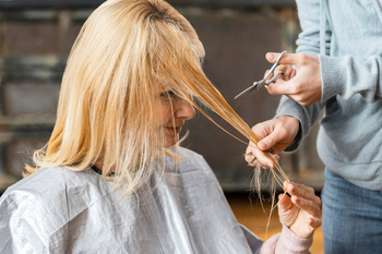 Cutting damaged bleached hair.