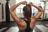 Girl fixing her hair at the gym.